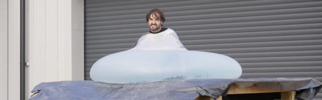 Man rolls downhill in giant water balloon in glorious slow motion