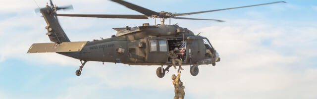 How Do Soldiers Sitting On The Edge Of Helicopters Not Fall Out