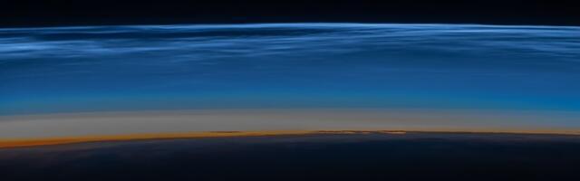 Astronaut snaps strange iridescent clouds at the edge of space