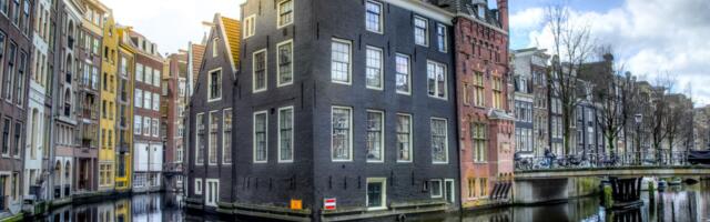 Adyen processes payments for Uber, Spotify, eBay, and Microsoft from an Amsterdam canal house where the engineering team still eats lunch at a single long table, and the company went public worth €7 billion with fewer staff than a midsize hotel