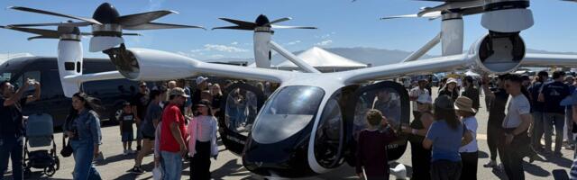 Flying taxis take flight in front of a US crowd for the first time as 2 companies race to take on passengers