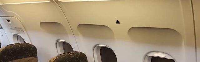 What Are The Triangle Symbols Above Airplane Windows For?