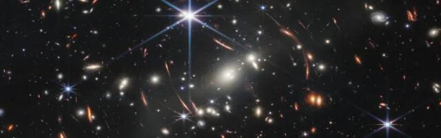 Gravitational lens shows a galaxy just 800 million years post-Big Bang