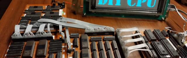 Passionate enthusiast builds a fully functional processor out of old memory chips — hand-solders every wire, writes 1800 lines of assembler code, and makes it play The Matrix on a VFD display