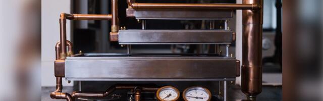 Custom-built passive water-cooled PC relies on convection chimney effect powered by triple-stacked radiators — 9800X3D build with RTX 5080 has no fans, copper, and radiator chimney, but struggles to keep temperatures down