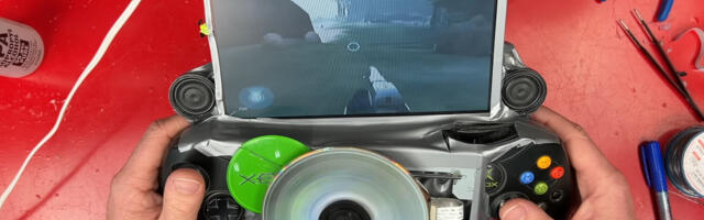 Modder takes hacksaw and hot glue to original Xbox to create a gaming handheld — ‘portable monstrosity’ has exposed spinning DVD in the center and plenty of duct tape, but works as intended