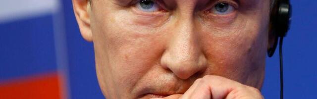 Putin tells Russians there's no reason to panic as the ruble sinks, but analysts say its economy is in trouble