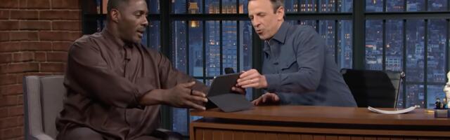 Idris Elba casually watches Arsenal game on iPad during Seth Meyers interview