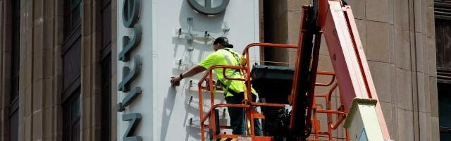 Twitter staff trying to remove the older logo from their building get detained by the police