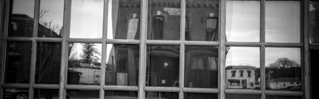 There’s a specific kind of grief that belongs to people who outgrew their hometown but never fully arrived anywhere else. They’re not homesick for the place. They’re homesick for the version of themselves that didn’t yet know the place was too small.