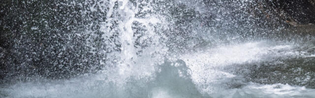 Small charges in water spray can trigger the formation of key biochemicals
