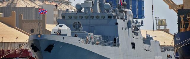 A Russian warship sailing between England and France fired warning shots at a British civilian yacht