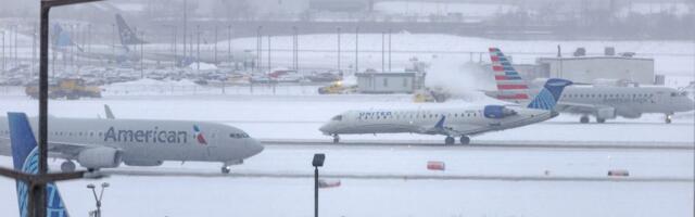 Travel chaos continues as winter storms batter both coasts