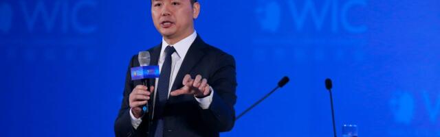 The founder of China's Amazon wants his 700,000 blue-collar workers to be 'white-collarized' in time for AI