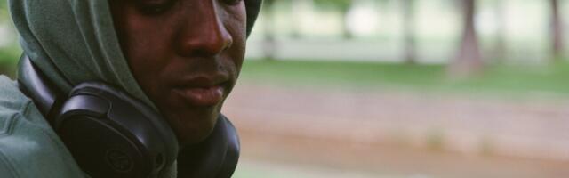 The person who always has headphones in — even when nothing is playing — isn’t ignoring you, they built a portable wall years ago because somewhere along the way they learned that being available to everyone meant being known by no one