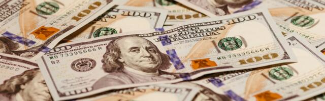 Fed holds rates steady; markets inch lower